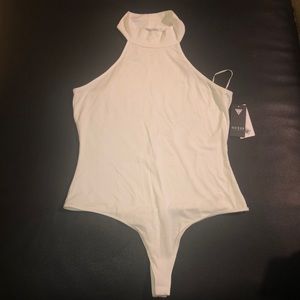 Sleeveless roll neck Bodysuit .